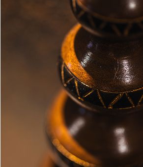 Close-up of decorative wooden sculpture details.