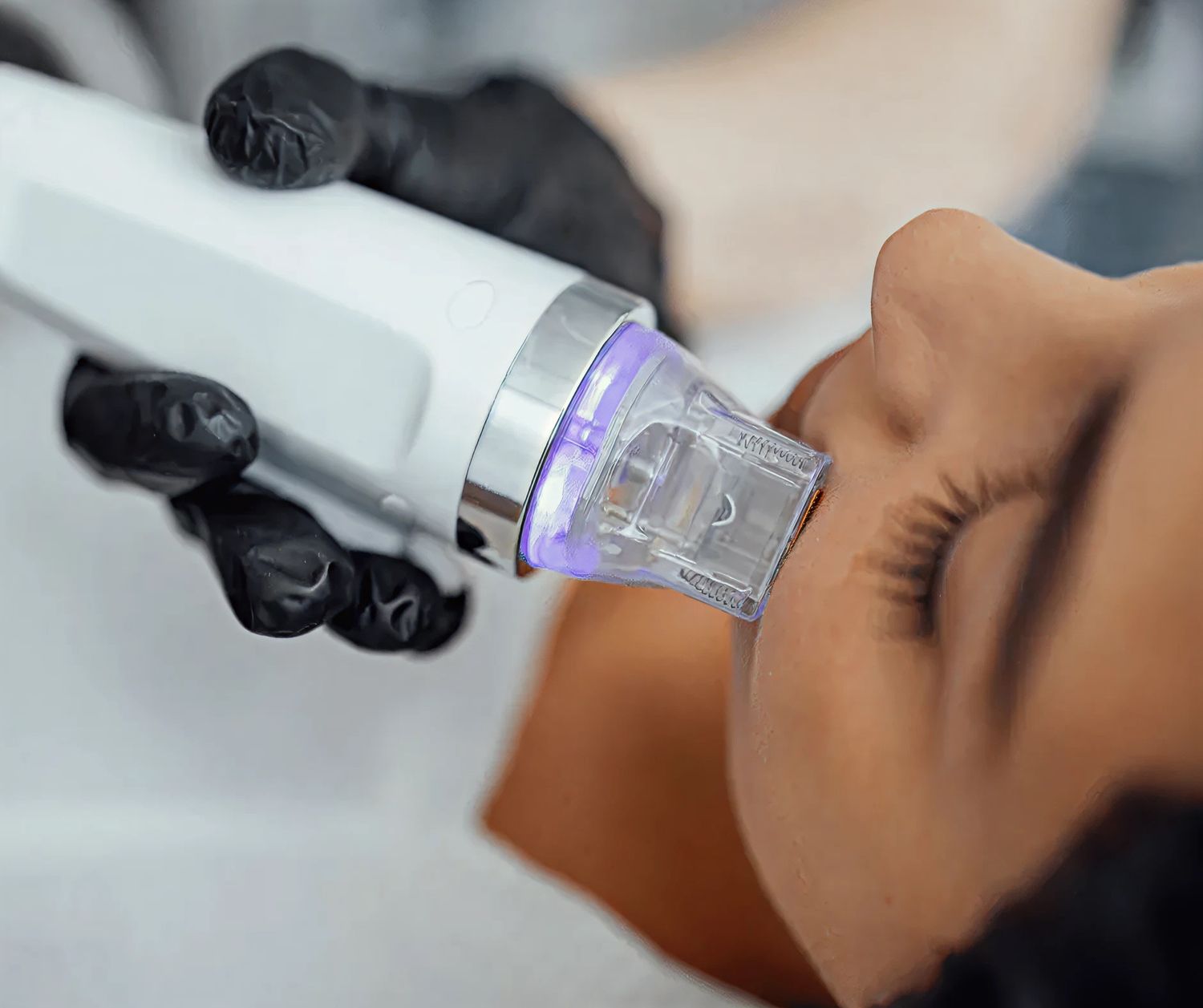 Smiling woman with blonde hair and natural makeup.