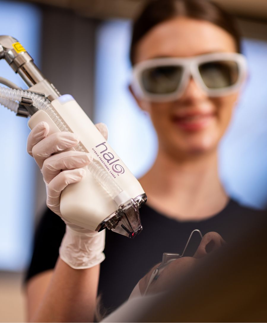 Medical professional using Halo laser treatment device