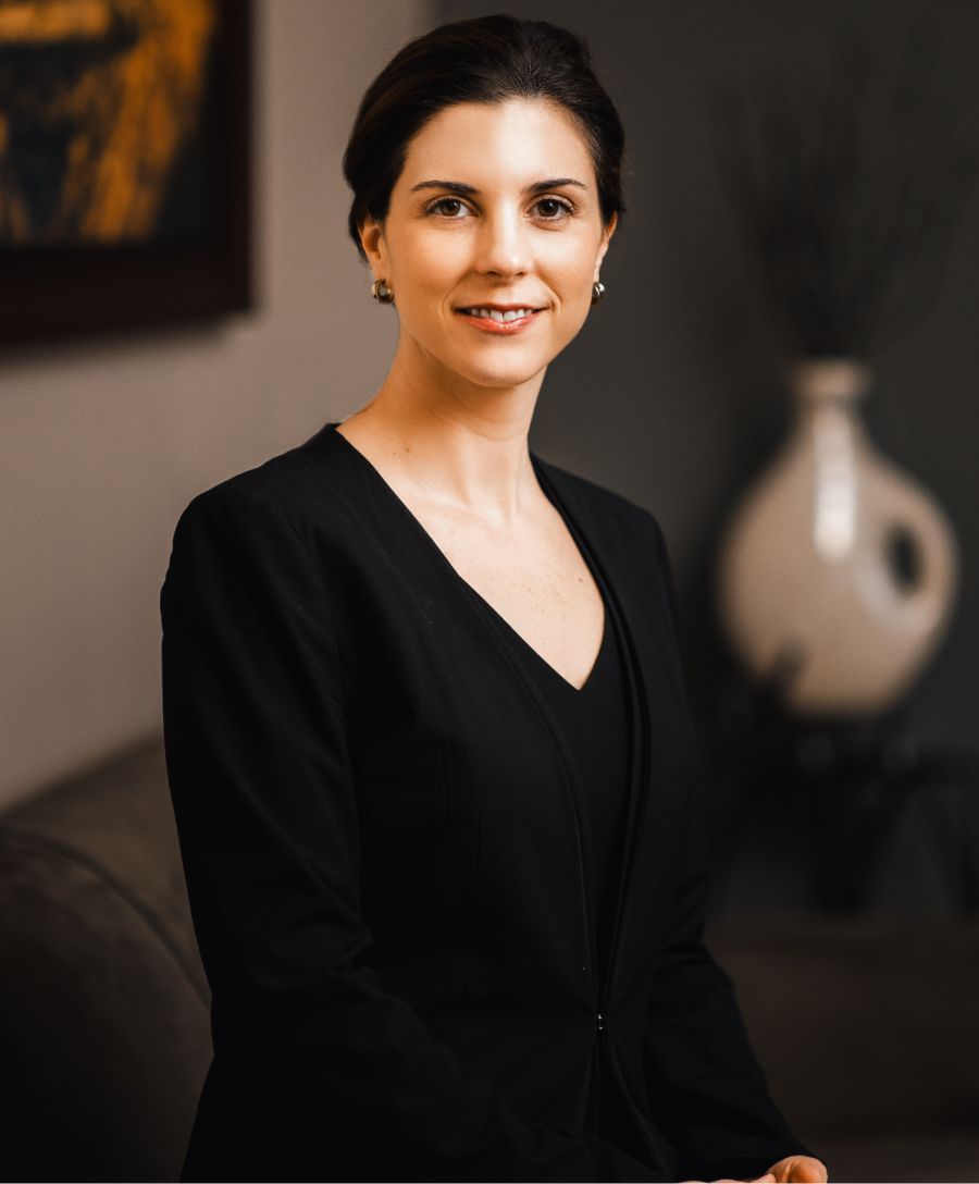 Dermatologist examining patient in consultation room.
