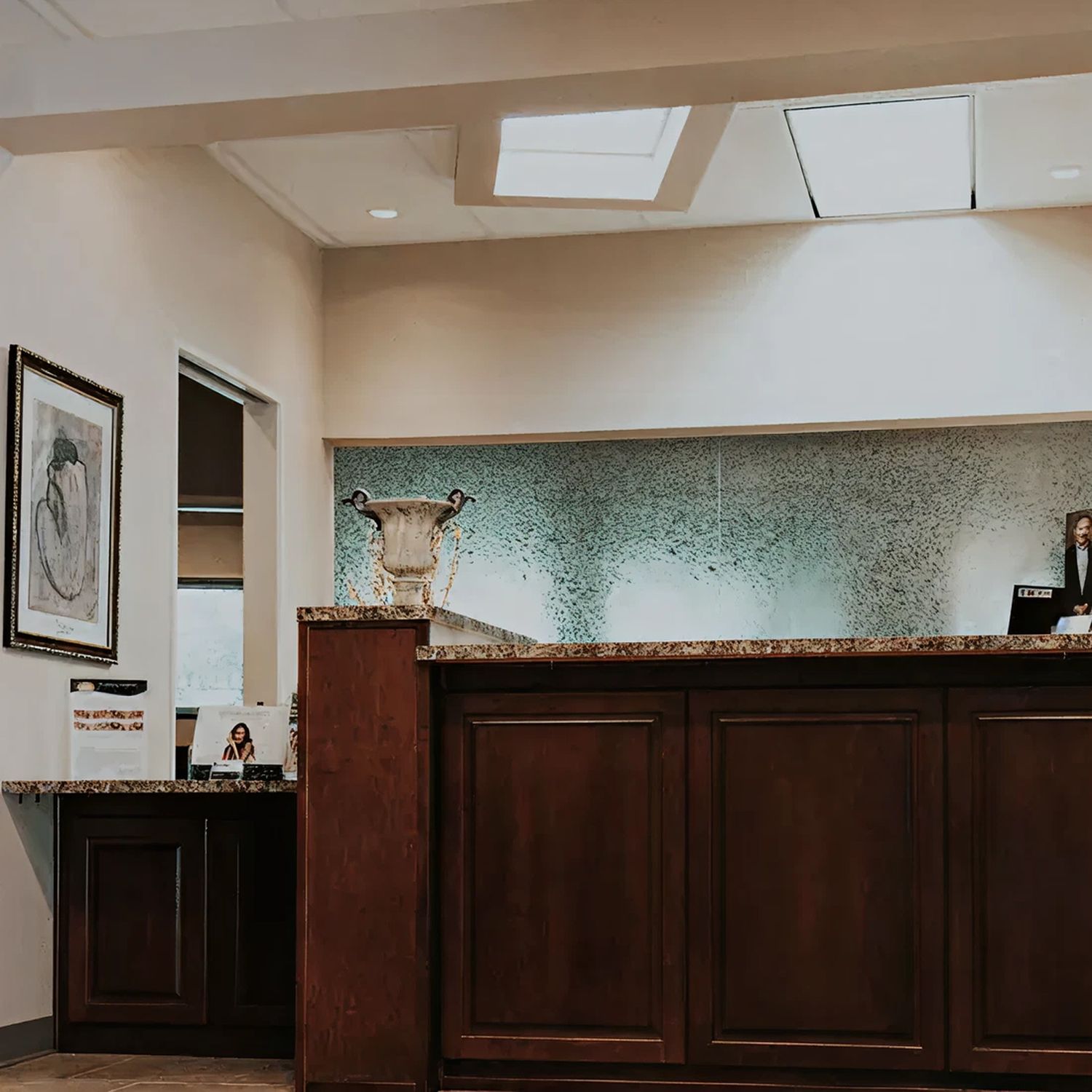 Modern reception desk with artistic decor.