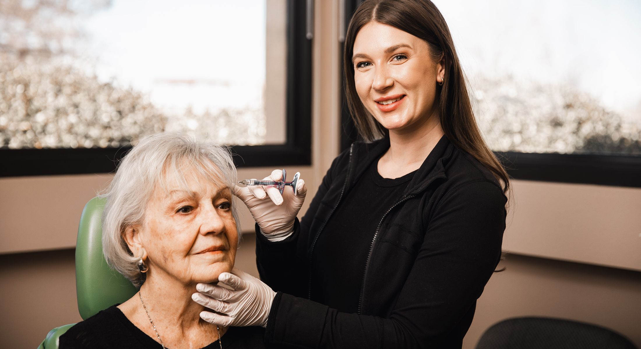 Cosmetic treatment in progress with a patient.