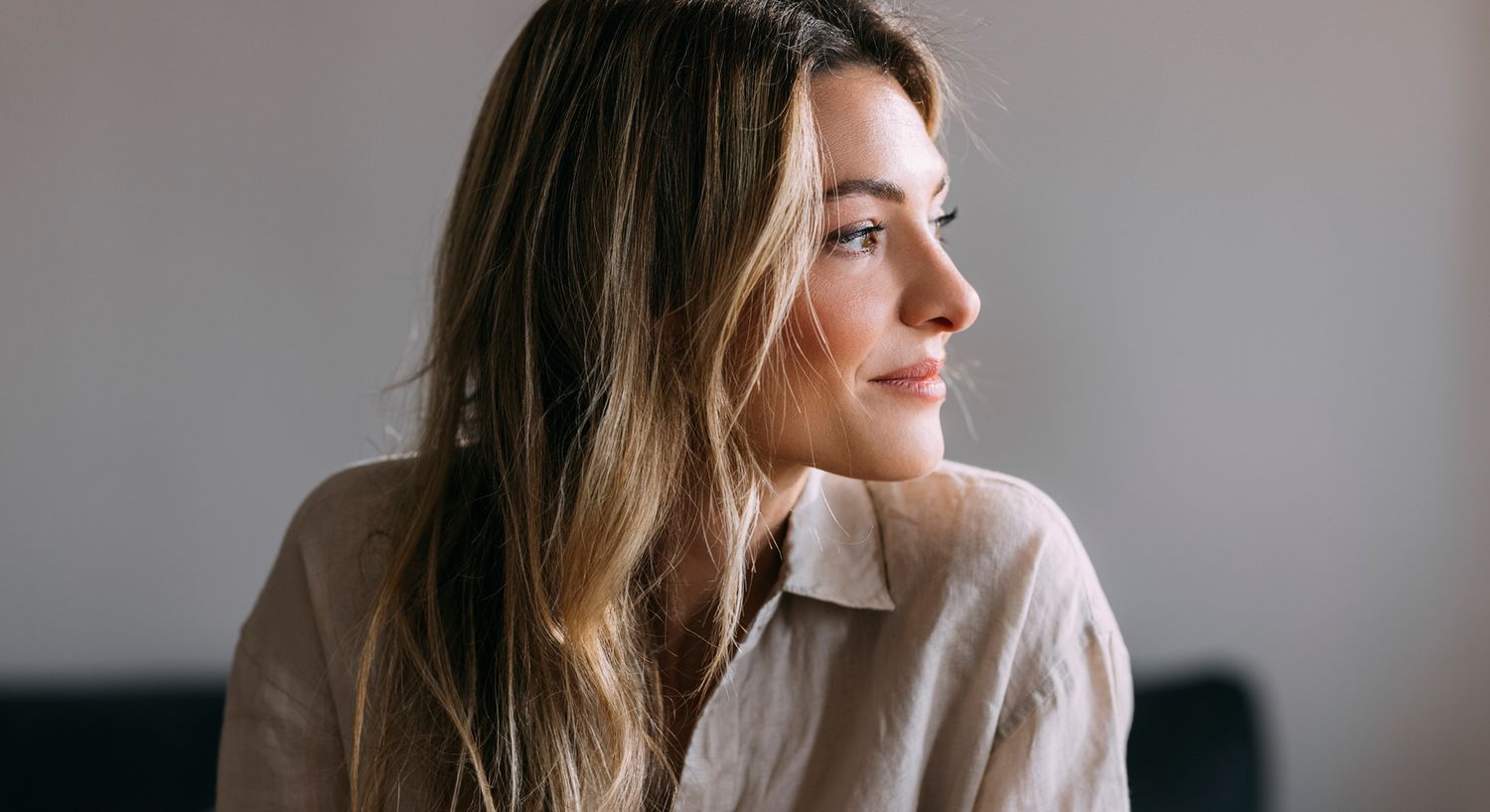 Woman with long hair in natural light.